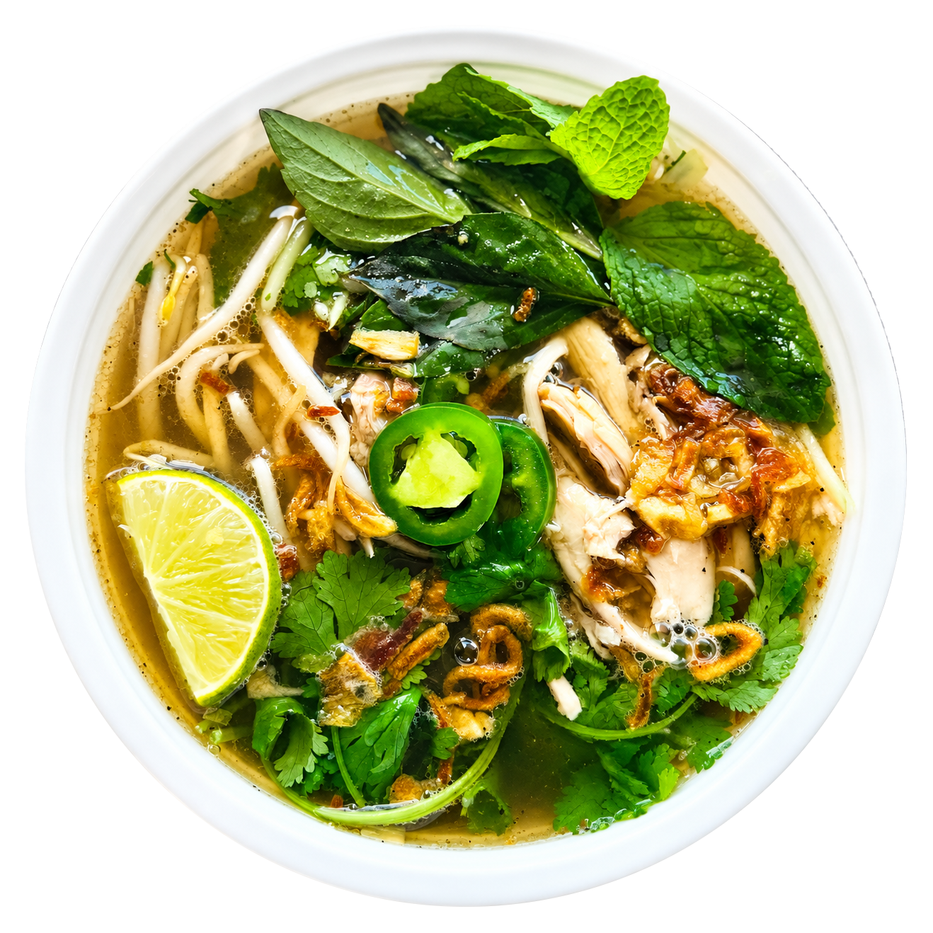 Chicken pho with fresh herbs, lime, and sliced jalapeños