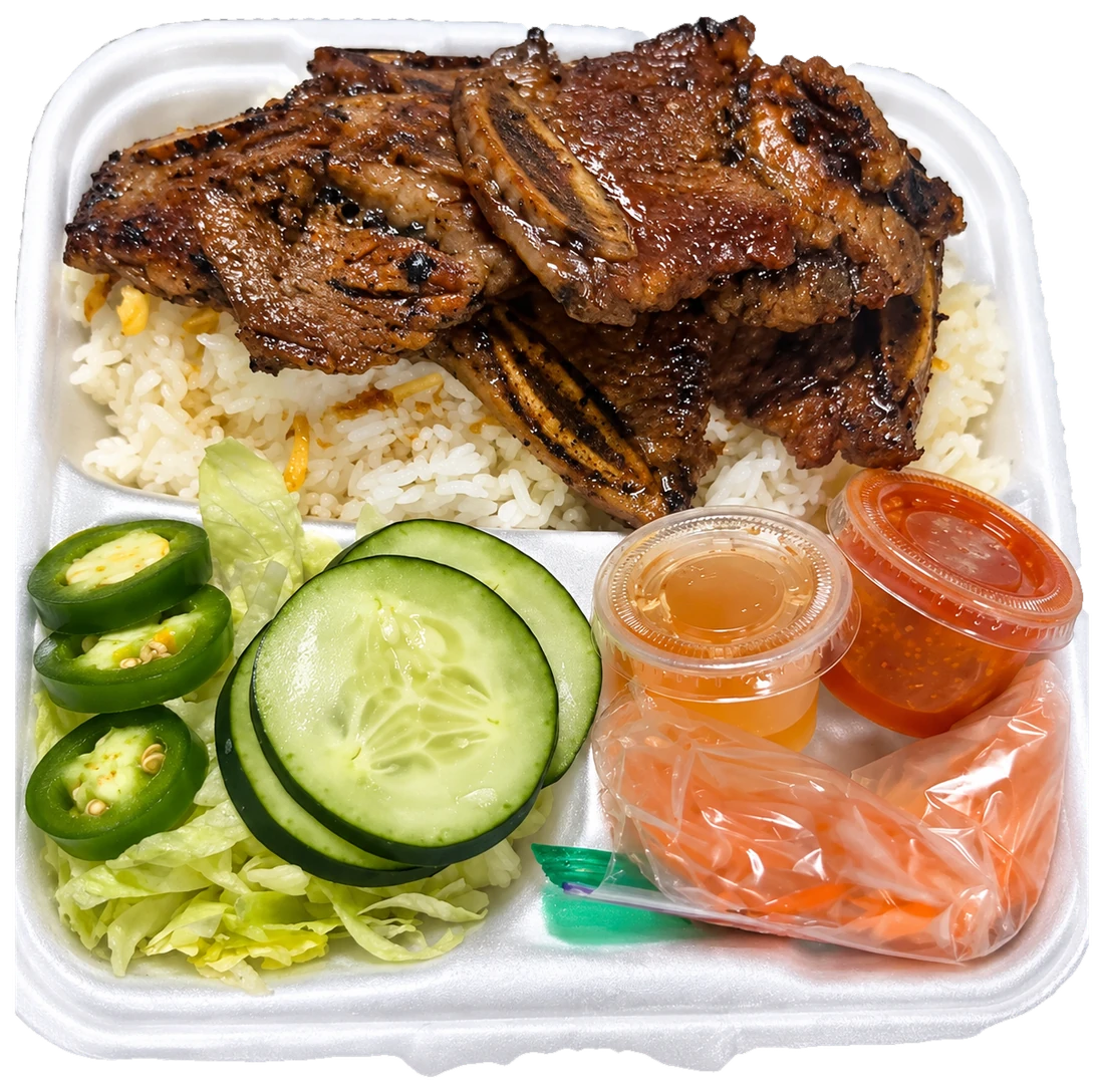 Asian short ribs over rice with sauces and accompaniments
